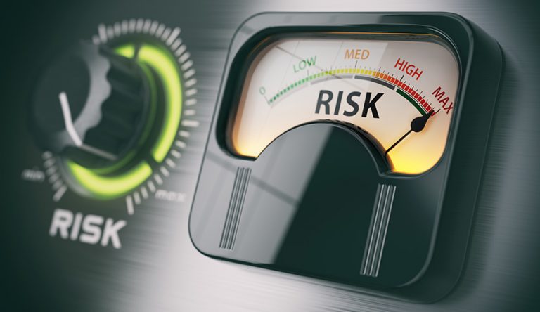 An image of a dial and a meter showing high risk