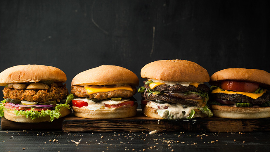 a row of different types of burgers