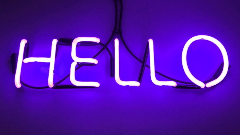 A neon sign with the word Hello